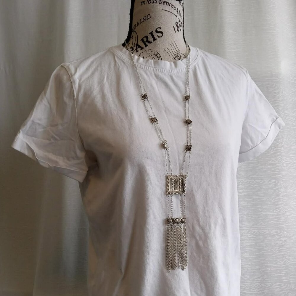 Unique and intricate statement necklace made of silver chains and pendants